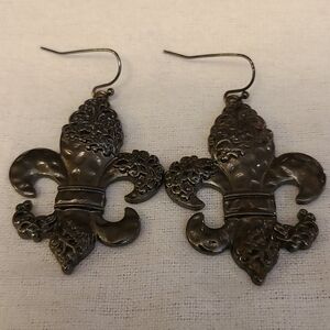 Fleur-de-le earrings pierced in gun metal black